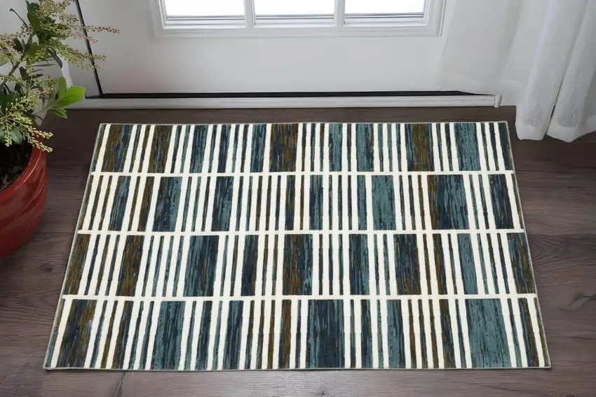 Ivory And Blue Geometric Area Rug Photo 1