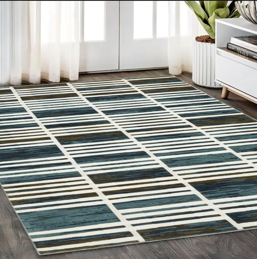 Ivory And Blue Geometric Area Rug Photo 1