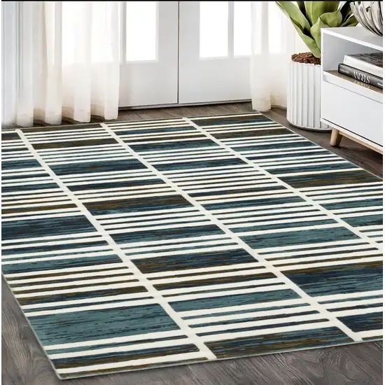 Ivory And Blue Geometric Area Rug Photo 1