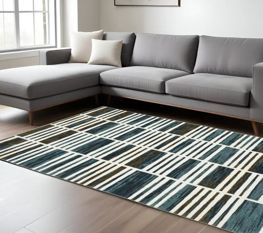Ivory And Blue Geometric Area Rug Photo 1