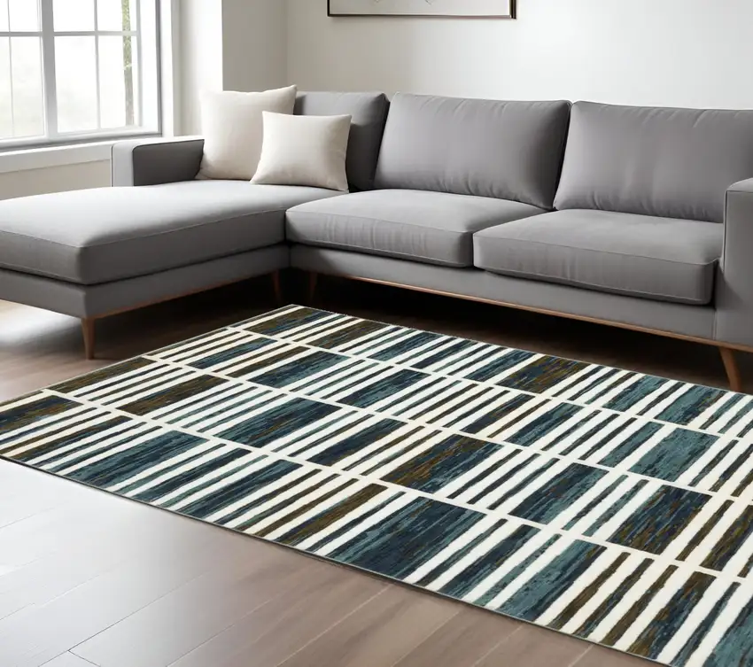 Ivory And Blue Geometric Area Rug Photo 1