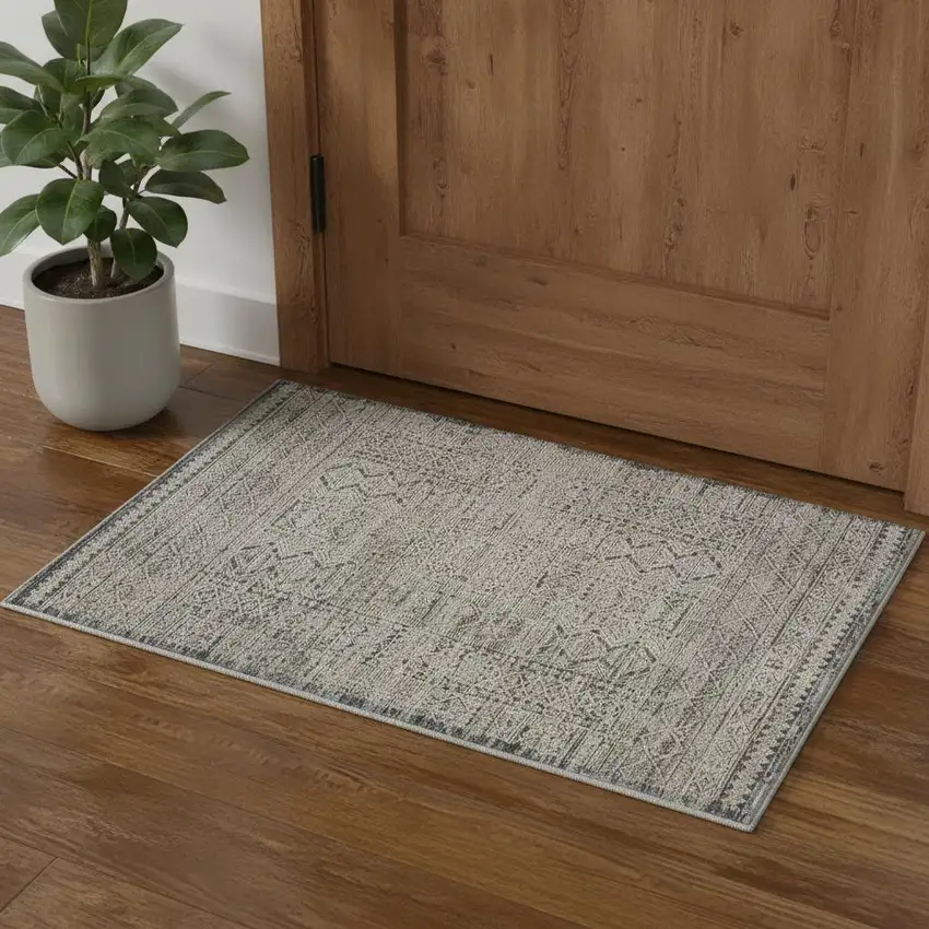 Ivory And Blue Geometric Distressed Area Rug With Fringe Photo 1