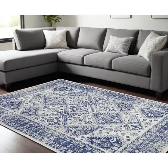 Ivory And Blue Geometric Distressed Area Rug Photo 1