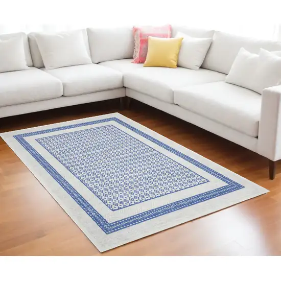 Ivory And Blue Geometric Distressed Area Rug Photo 1