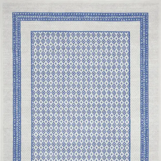 Ivory And Blue Geometric Distressed Area Rug Photo 9
