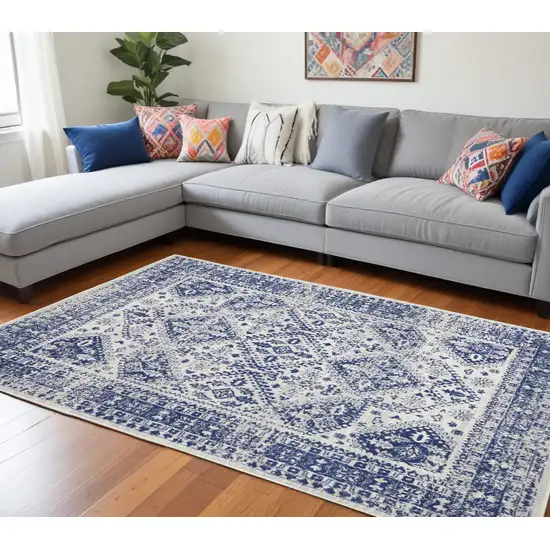 Ivory And Blue Geometric Distressed Area Rug Photo 1