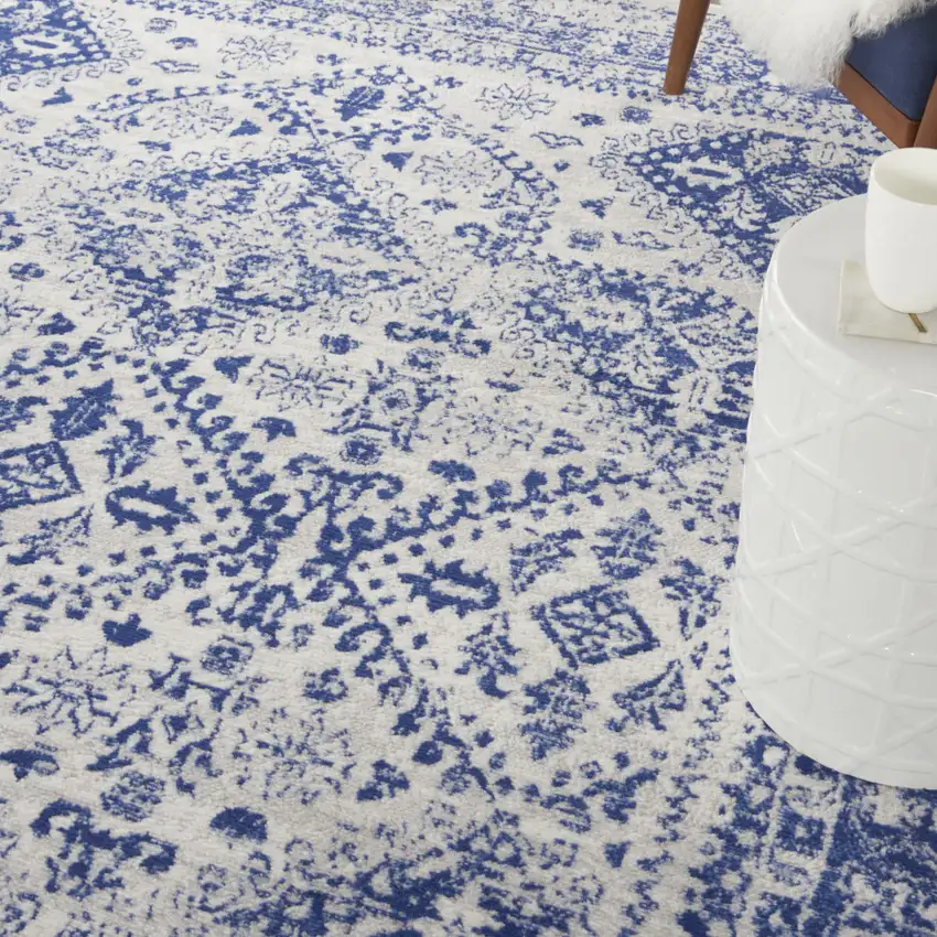 Ivory And Blue Geometric Distressed Area Rug Photo 9