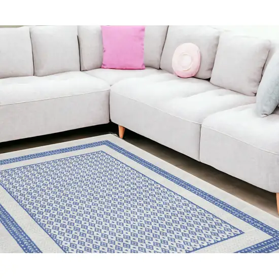 Ivory And Blue Geometric Distressed Area Rug Photo 1