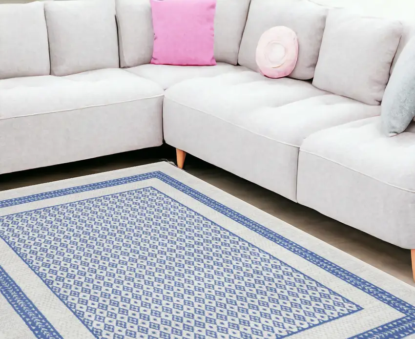 Ivory And Blue Geometric Distressed Area Rug Photo 1