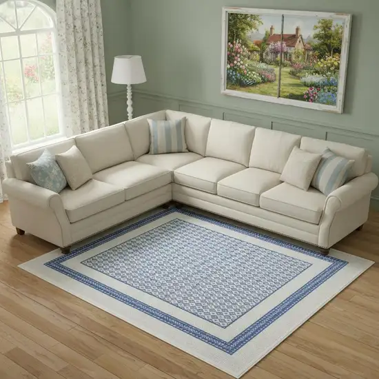 Ivory And Blue Geometric Distressed Area Rug Photo 1