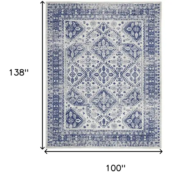 Ivory And Blue Geometric Distressed Area Rug Photo 3