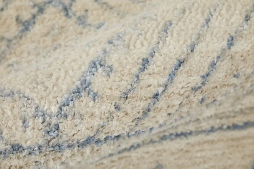 Ivory And Blue Geometric Power Loom Distressed Area Rug Photo 9