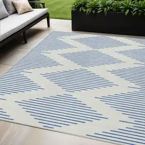 Photo of Ivory And Blue Geometric Washable Indoor Outdoor Area Rug