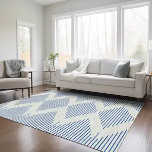 Photo of Ivory And Blue Geometric Washable Indoor Outdoor Area Rug