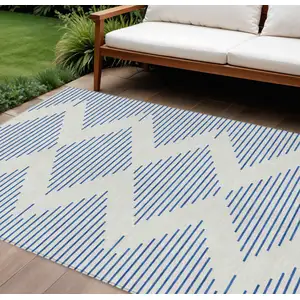 Photo of Ivory And Blue Geometric Washable Indoor Outdoor Area Rug