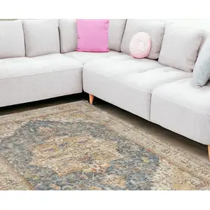 Photo of Ivory And Blue Oriental Distressed Area Rug