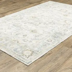 Photo of Ivory And Blue Oriental Hand Tufted Area Rug