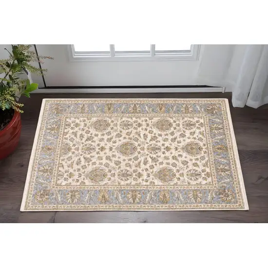 Ivory And Blue Oriental Power Loom Stain Resistant Area Rug With Fringe Photo 1