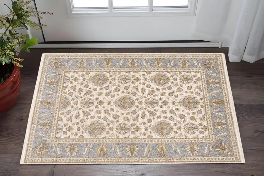 Ivory And Blue Oriental Power Loom Stain Resistant Area Rug With Fringe Photo 1