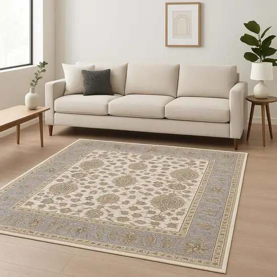 6' X 9' Ivory And Blue Oriental Power Loom Stain Resistant Area Rug With Fringe Photo 1
