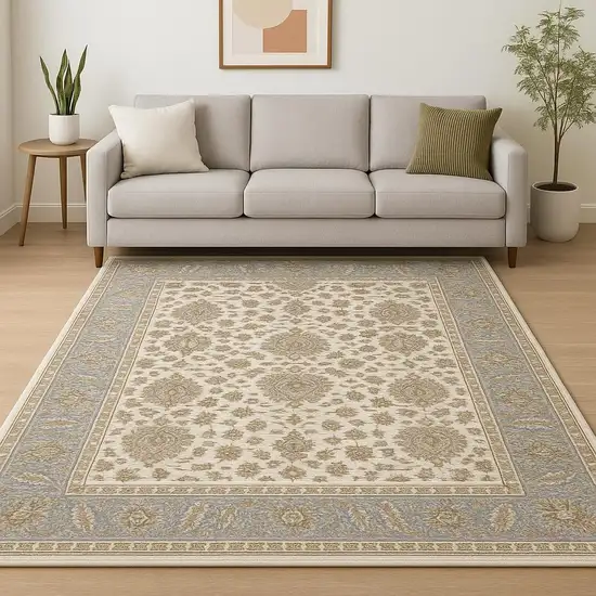 Ivory And Blue Oriental Power Loom Stain Resistant Area Rug With Fringe Photo 1