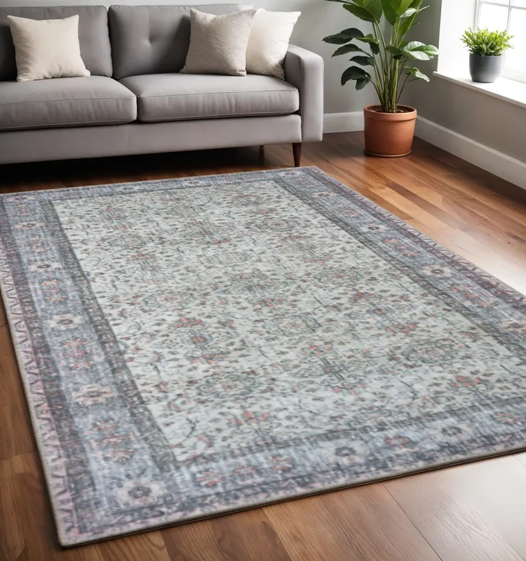 Ivory And Blue Oriental Power Loom Stain Resistant Area Rug Photo 5
