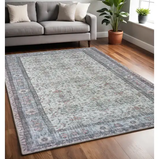 Ivory And Blue Oriental Power Loom Stain Resistant Area Rug Photo 1