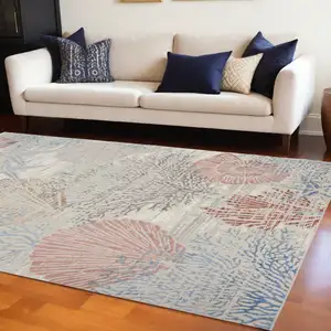 Photo of Ivory And Blue Seashell and Coral Area Rug