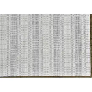 Photo of Ivory And Blue Striped Hand Woven Area Rug