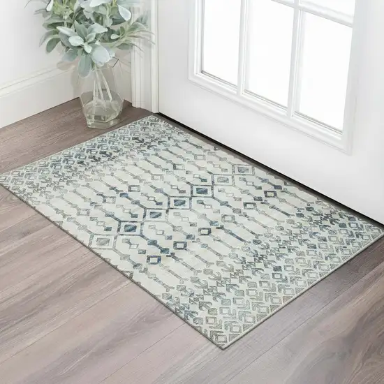 Ivory And Blue Tribal Washable Area Rug With UV Protection Photo 1