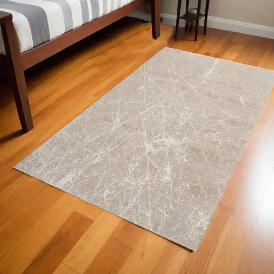 Ivory And Brown Abstract Area Rug Photo 1