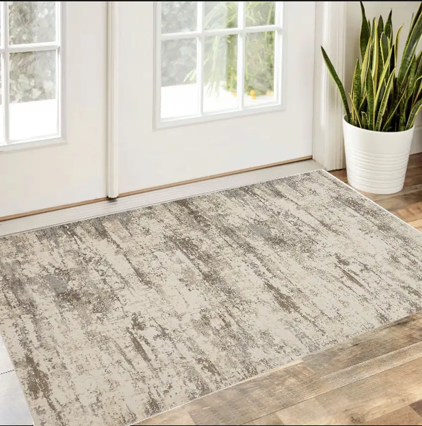 Ivory And Brown Abstract Area Rug Photo 1