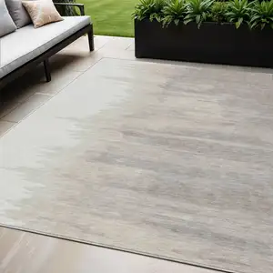 Photo of Ivory And Brown Abstract Washable Indoor Outdoor Area Rug