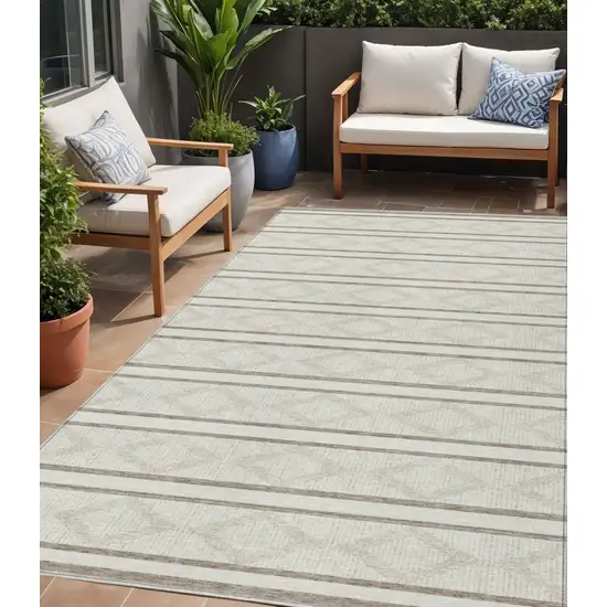Ivory And Brown Geometric Washable Indoor Outdoor Area Rug Photo 1