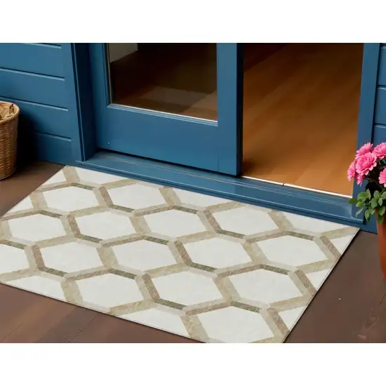 Ivory And Brown Geometric Washable Indoor Outdoor Area Rug Photo 1