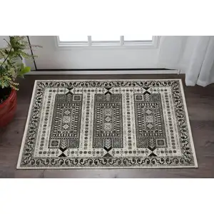 Photo of Ivory And Charcoal Oriental Area Rug With Fringe