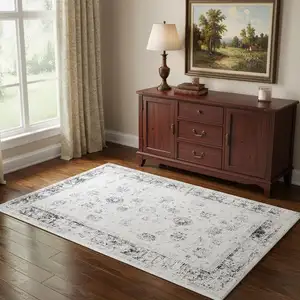 Photo of Ivory And Charcoal Oriental Distressed Washable Area Rug
