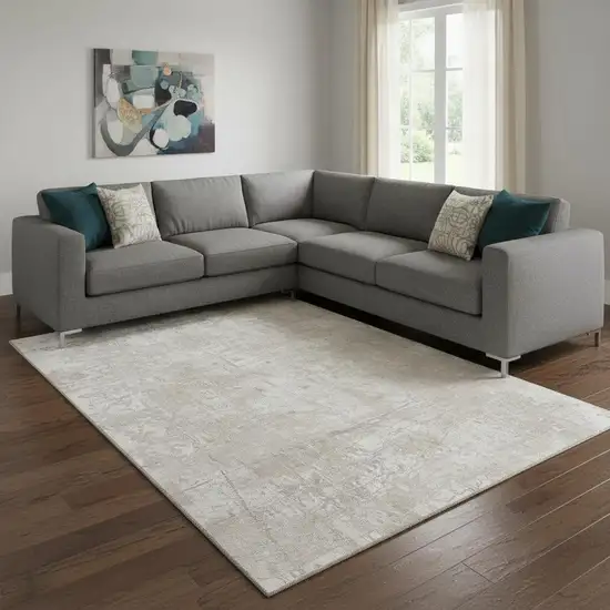 Ivory And Cream Abstract Washable Area Rug With UV Protection Photo 1