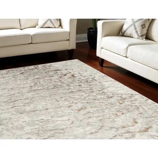 Ivory And Gold Abstract Area Rug Photo 1