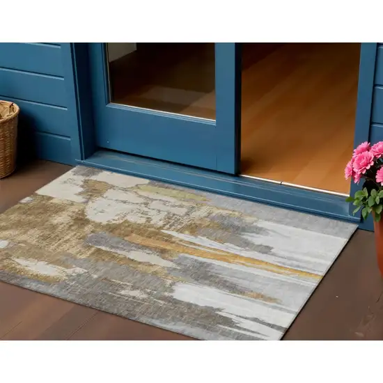 Ivory And Gold Abstract Washable Indoor Outdoor Area Rug Photo 2
