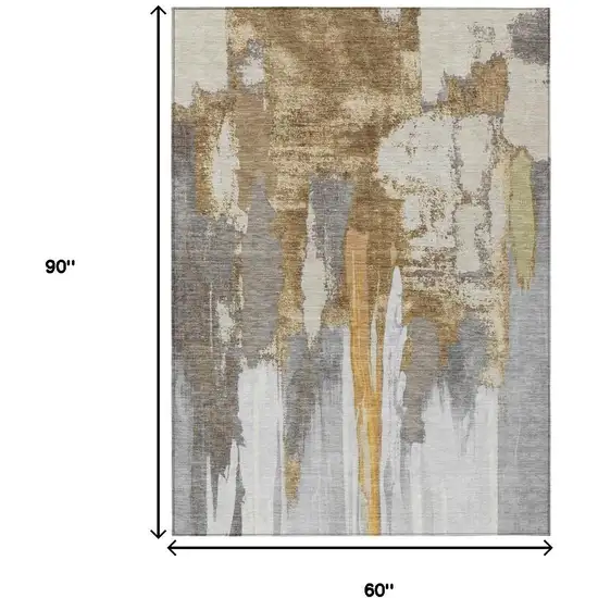 Ivory And Gold Abstract Washable Indoor Outdoor Area Rug Photo 9