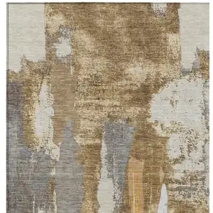 Photo of Ivory And Gold Abstract Washable Indoor Outdoor Area Rug