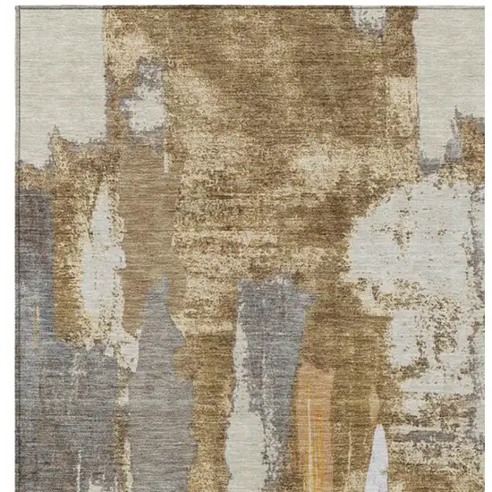 Ivory And Gold Abstract Washable Indoor Outdoor Area Rug Photo 1