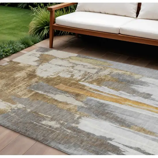 Ivory And Gold Abstract Washable Indoor Outdoor Area Rug Photo 2