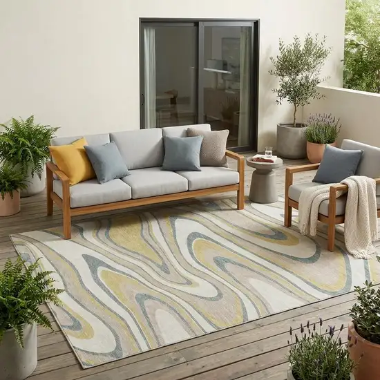 Ivory And Gold Abstract Washable Indoor Outdoor Area Rug Photo 1