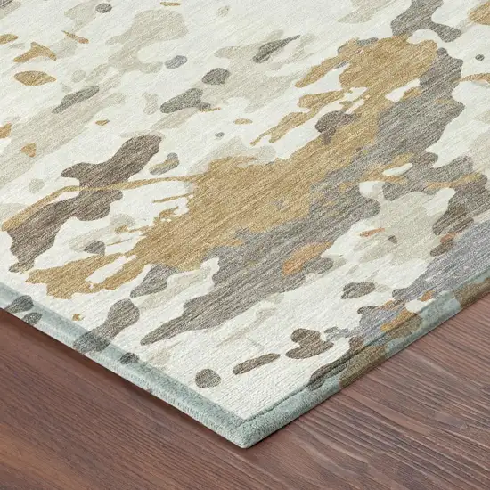 Ivory And Gold Abstract Washable Indoor Outdoor Area Rug Photo 4