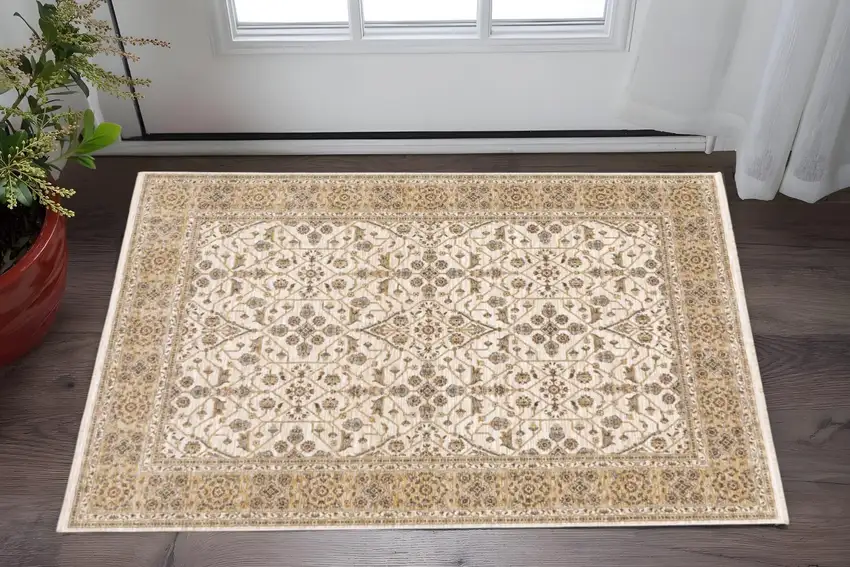 Ivory And Gold Oriental Power Loom Stain Resistant Area Rug With Fringe Photo 1