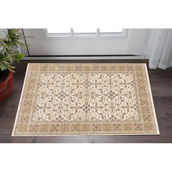 Ivory And Gold Oriental Power Loom Stain Resistant Area Rug With Fringe Photo 1