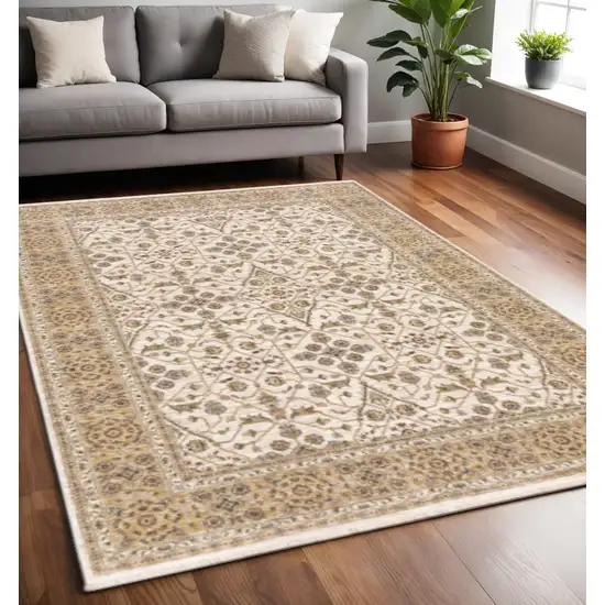 Ivory And Gold Oriental Power Loom Stain Resistant Area Rug With Fringe Photo 1