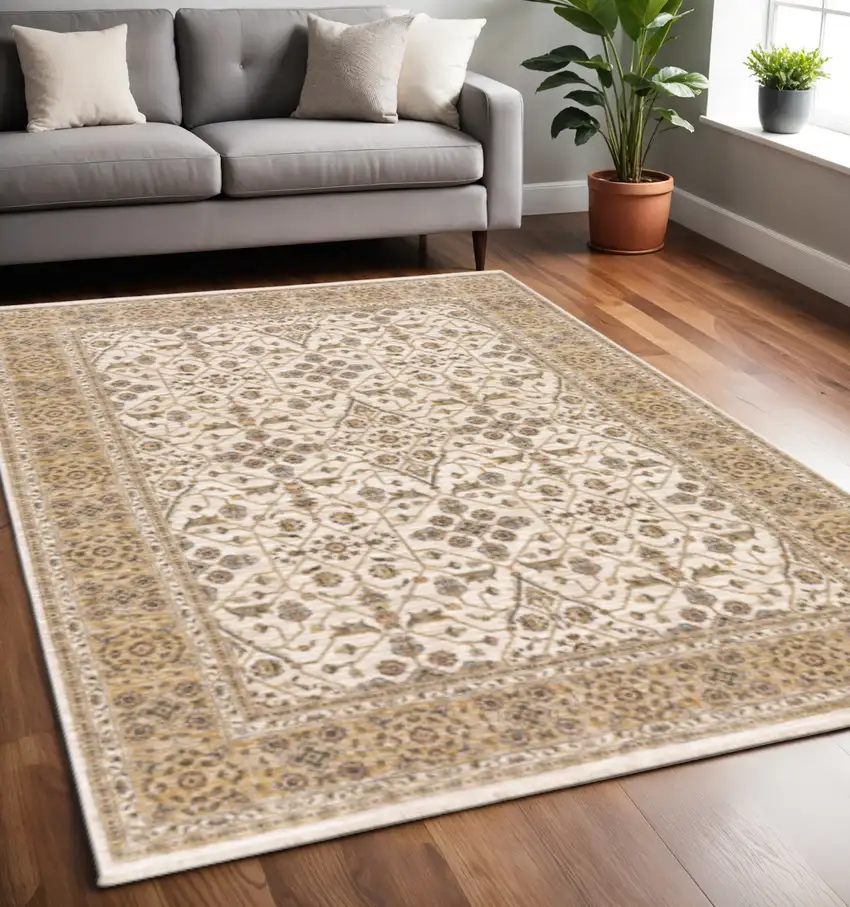 Ivory And Gold Oriental Power Loom Stain Resistant Area Rug With Fringe Photo 1